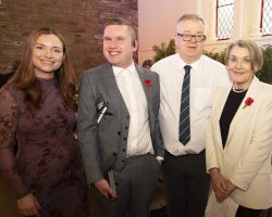 From left to right: Singer Claire Hastings, co-host Lewis Shaw, The Usual Place CEO Craig McEwen, Co-Host Fiona Armstrong. Four smartly dressed people stand smiling at the camera